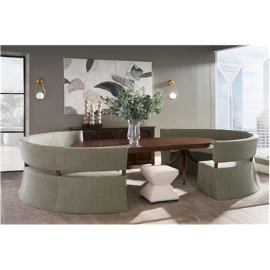 Room Scene: HC4607-72 - Luna Quarter-Turn Banquette shown in HC480-72 fabric with Truffle finish; (2) HC185-71- Ingold Three Leg Pedestal Bases with HC180-71 Ingold Oval Expansion Top shown in Truffle finish; HC6445-70 - Amelia Sideboard shown in Java finish and HC9502-29 - Serge Ottoman shown in HC379-91 fabric with Truffle finish.
