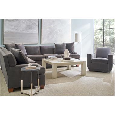 HC7644-49/54/55 Foster Sectional shown in fabric HC261-64 with Dark Walnut finish, HC128-27 Knox Swivel Chair shown in fabric HC182-68, HC3081-70 Phillip Cocktail Table shown in Chalk finish and HC6494-13081*0S Alfred Spot Table with Stone Top shown in Chalk finish.