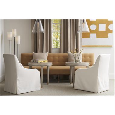 Room Scene: HC1319-01 Mila Skirted Dining Chair, fabric HC4150-10; HC1386-70 Mobile Accent Table, shown in Lynx finish and HC1310-51 Laurent M2M® Banquette, fabric HC3087-27, shown in Tawny finish