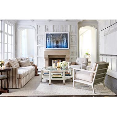 Room Scene: HC3422-90 Meredith Sofa shown in fabric HC373-15, two striped throw pillows from David Phoenix in COM, HC3427-23 Griswold Lounge Chair shown in fabric HC296-14 and in optional Weathered White paint, HC3479-10 Raffles Cocktail Table shown in optional Chalk finish and HC3484-10 Carmelina Side Table shown in standard Truffle finish.