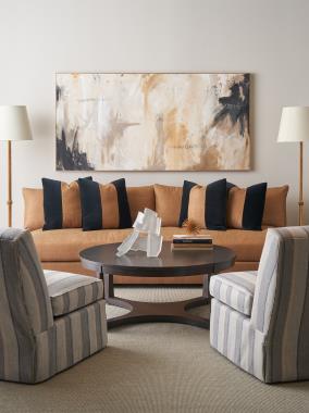 Room Scene: HC4400-08 Vistage Armless Sofa with custom bench seat, 10MT modern tapered base and KEB knife edge back shown in fabric HC253-82, Espresso finish and  four optional 22” x 22” Throw Pillows shown in fabric HC261-69 & HC253-82; HC4200-00 Silhouettes Armless Chair with dressmaker shown in fabric HC345-64 and HC183-70 Bowman Cocktail Table shown in Ebony finish.