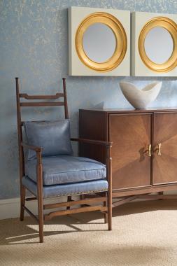 Room Scene: HC337-23 Country Occasional Chair shown in HC148 leather with Truffle finish and HC4600-70C2 Textures 4 Door Credenza shown in Truffle finish with (F11) Radial Walnut doors, (TPA) Tapered Antique Brass Ferrules and COH Hardware.