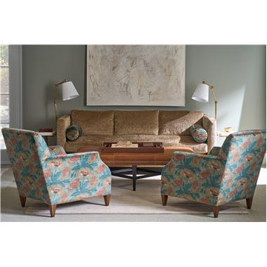 Room Scene: HC9003-88 Vero Sofa shown in HC273-82 with HC806-74 on bolsters, HC1001-24 Lorens Chair shown in HC806-74-LIBERTY fabric with HC328-82 welt and Truffle finish, HC126-30 Bexley Cocktail Ottoman shown in HC922 leather with Black Pearl nail trim and Kohl finish and HCP9143-STK Adair Spot Table.