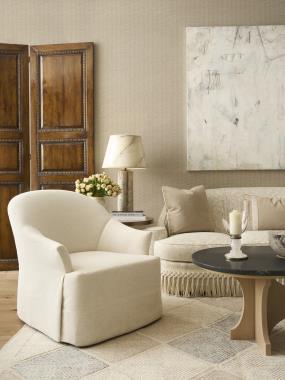 Room Scene: HC3515-24  Aurelia Chair shown in HC191-10 fabric; HC3520-70 Oliver Cocktail table shown in Baja finish; HC3400-06 Athena Sofa shown in HC393-12 fabric with HCBF-10 bullion fringe and  HCP3486-STK Avino Side Table.